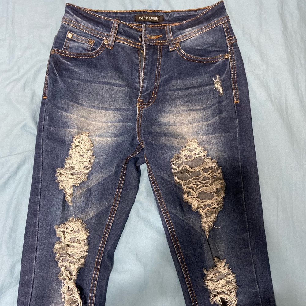 ripped dark blue jeans